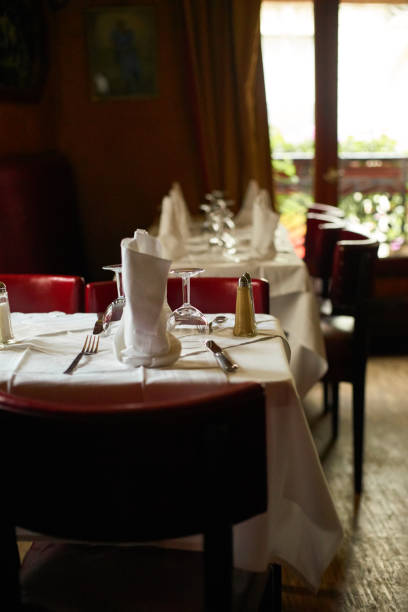 istock Traditional restaurant in Paris. Empty interior with tables set 1207490333