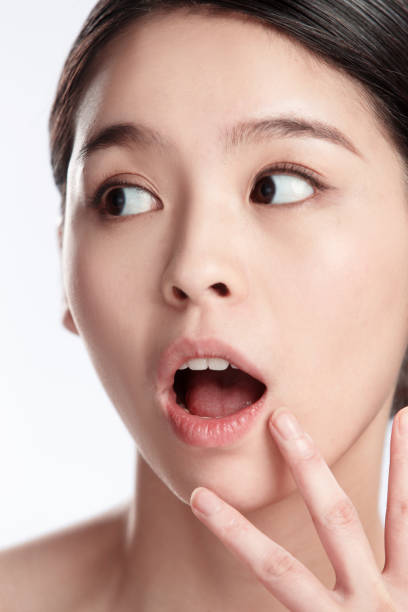 istock Young woman makeup face portrait 1207492859