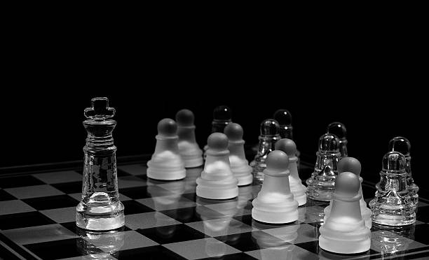istock pawns in order against the king 120749336