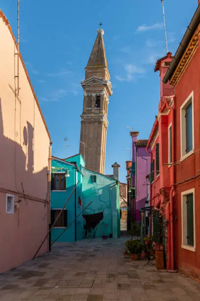 The leaning bell tower of Burano (Venice, Italy) on a sunny day in winter