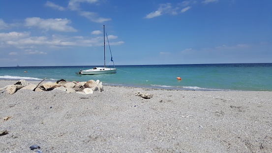 single yacht on lonely dream beach on the Black Sea in Romania