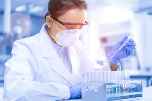 Young female scientist working in the CDC laboratory. stock photo