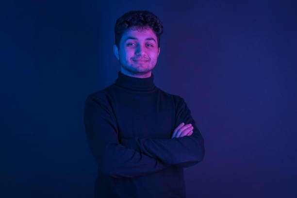istock Neon portrait of a young attractive man 1207499622