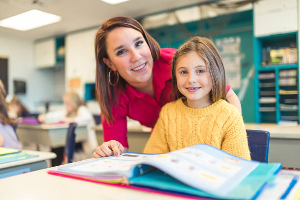 istock education and school concept little student girl studying at school 1207500351