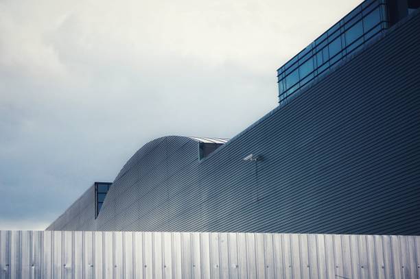 istock Metalic wall in front of an office building 1207500409