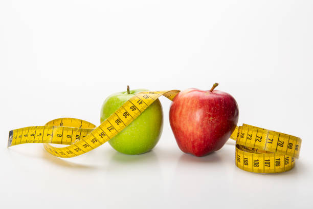 istock Diet Concept with Apple and Tape Measure 1207501043