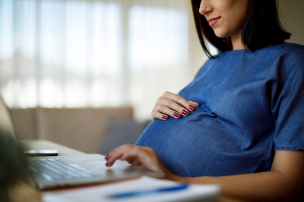 istock Pregnant woman working from home 1207502463