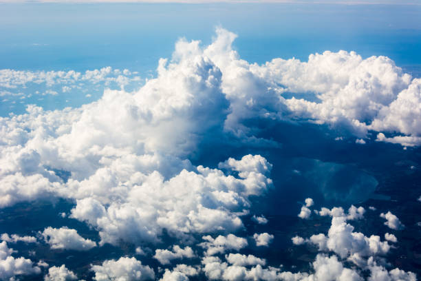 stratosphere, view of clouds and the earth from a height of 12,000 meters - cloud cloudscape stratosphere above imagens e fotografias de stock