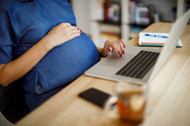 istock Pregnant woman working 1207503609