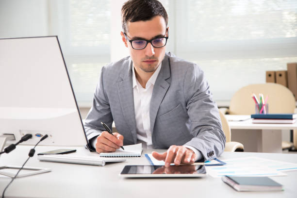 istock Businessman working in an office 1207504186