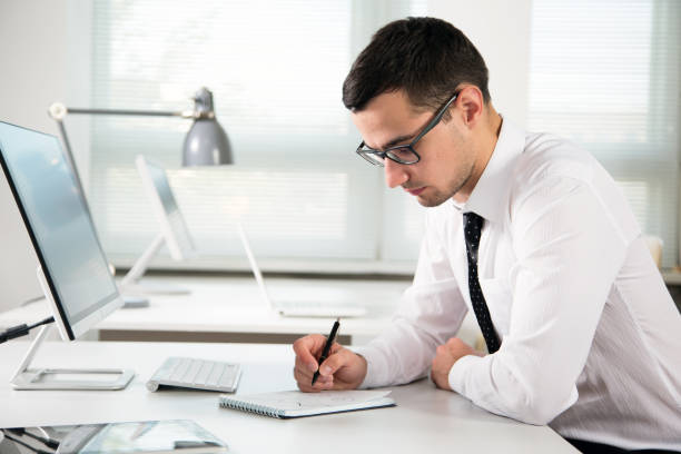 istock Young businessman working in an office 1207504804
