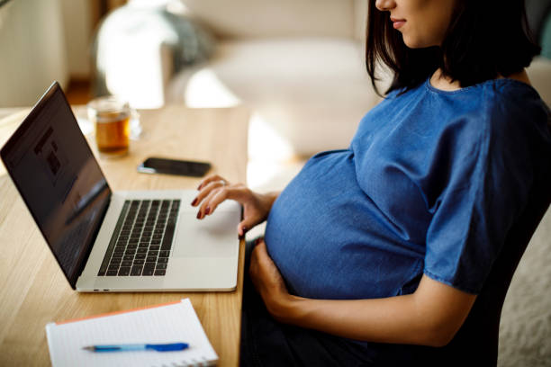 istock Pregnant woman working from home 1207504967