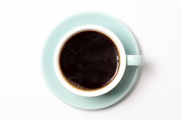 istock coffee cup top view closeup isolated on white background. 1207505062