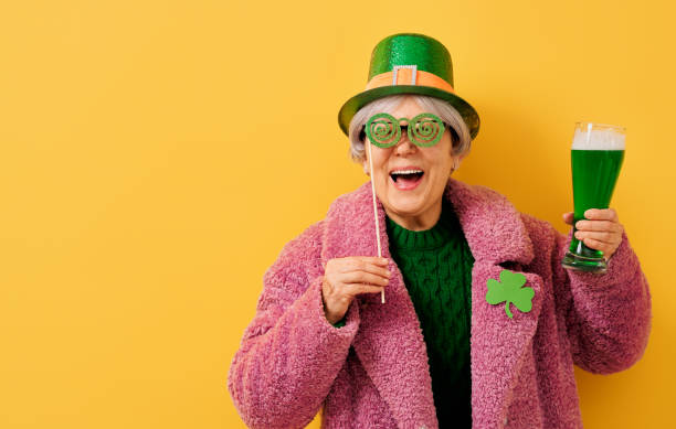 woman in leprechaun hat The senior woman in leprechaun hat for a Saint Patrick's Day. st. patricks day photos stock pictures, royalty-free photos & images