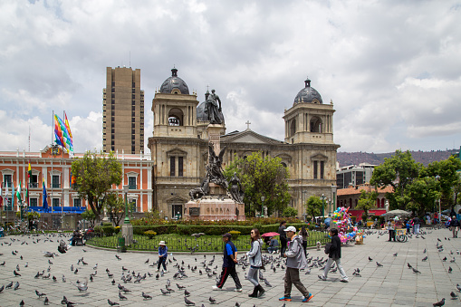 La Paz, Bolivia - October 24, 2015: People on Plaza Murillo with the cathedral in the background.