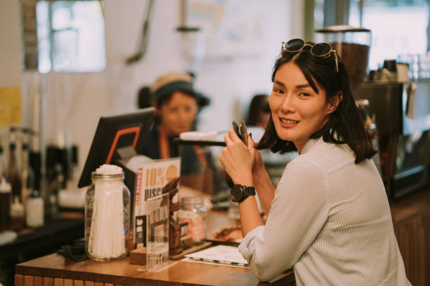 istock Customer women looking on the camera at the cafe 1207507434