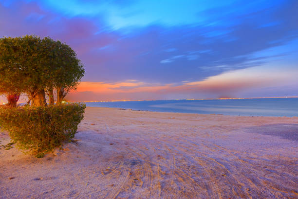 Long exposure shot of amazing sunset with beautiful colours in sky taken at sea side of shuwaikh in kuwait
