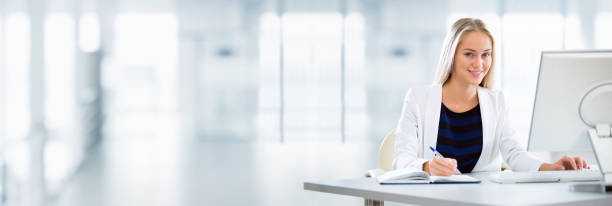 Young business woman using computer at office stock photo