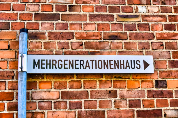 istock Street sign that points to a multi-generational house. 1207509123