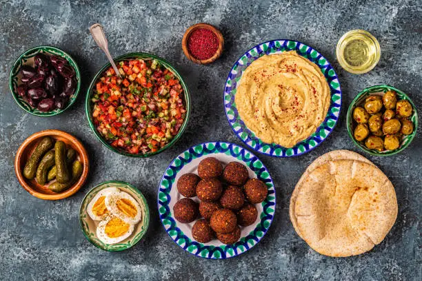 Falafel and hummus - traditional dish of Israeli and Middle Eastern cuisine, top view.