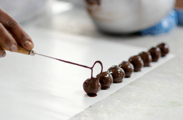 Woman preparing chocolate in a factory