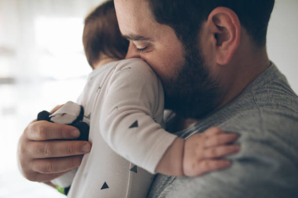 istock Happy father holding his daughter 1207512517