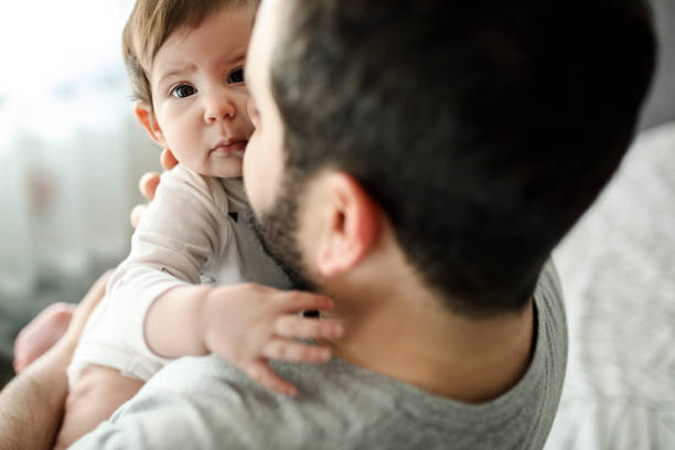 istock Happy father holding his daughter 1207512587