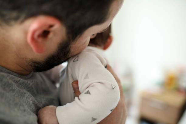 istock Happy father holding his daughter 1207513294