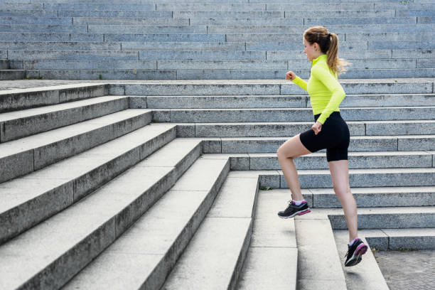 istock sporty female runner in modern business district 1207513384