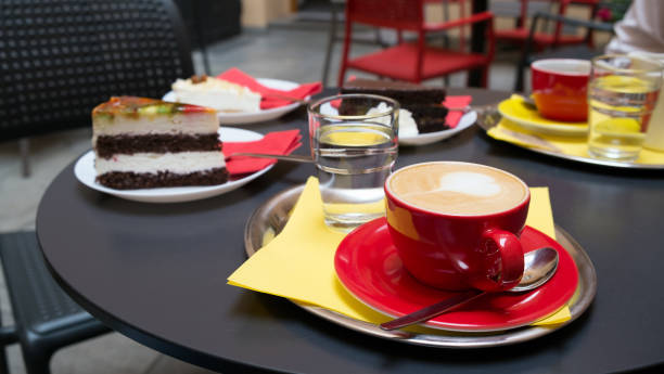 istock Breakfast with cappuccino and cakes in a summer cafe 1207513737