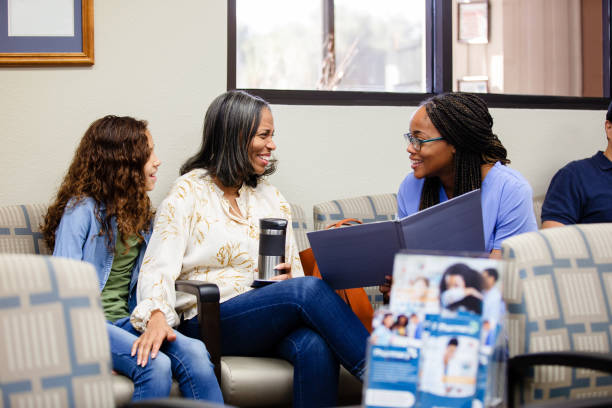 A grandmother talks with nurse in doctor's office
