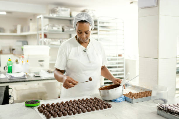 istock Woman preparing chocolate in a chocolate factory 1207514033