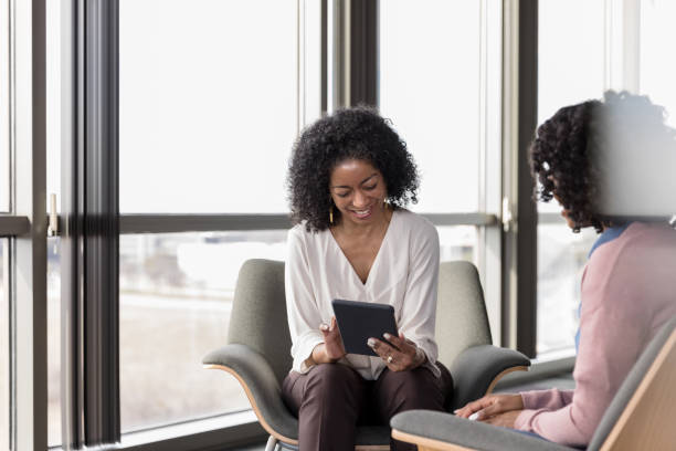 istock Mature psychiatrist uses digital tablet to prescribe medication for client 1207514083