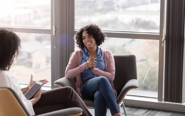 istock Woman is happy to hear what unrecognizable therapist says 1207514101