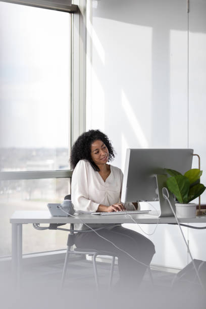 istock Cheerful businesswoman at work 1207514162