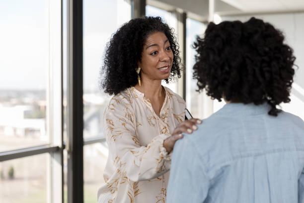 istock Therapist consoles female patient 1207514191