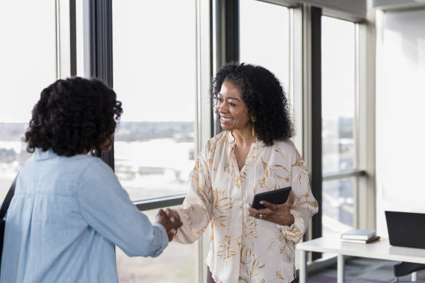 istock Businesswoman greet each other before meeting 1207514197