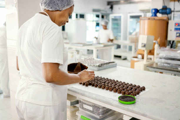 istock Woman preparing chocolate in a chocolate factory 1207515746