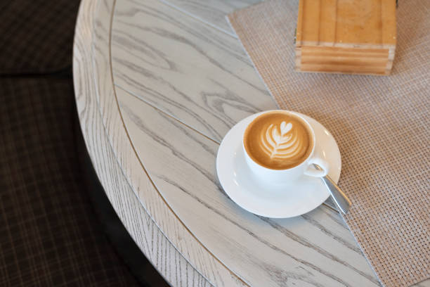 istock Fresh coffee latte with milk foam drawed heart tree shape art. Caffeine additcition. 1207519717