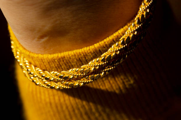 istock young woman wearing gold bracelet 1207522410