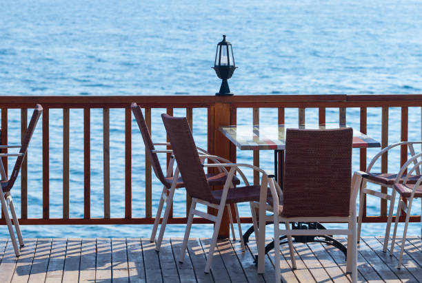 istock Cafe with an empty table by the sea in Kemer 1207524458