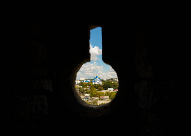 rural country side view with orthodox church on a hill frame work key hole shape black space for copy or text foreground