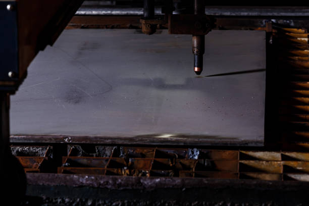 Plasma cutting of metal with a cnc. Plasma cutting machine cutting steel sheet. Laser cutter in production. Industrial metal cutting by plasma laser