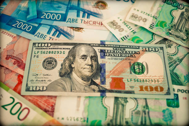 istock New banknote hundred dollars and russian rubles. 1207526082