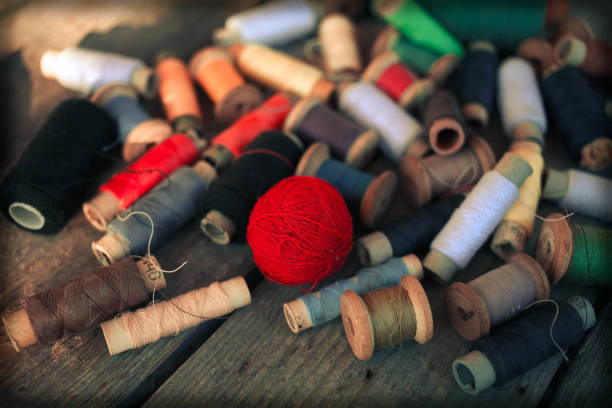 istock Old  thread  on the old wooden background. Vintage Background 1207526780