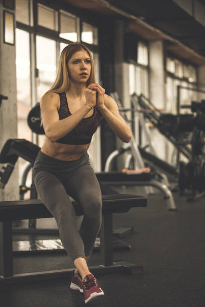 istock Athletic woman mastering  single-leg squat exercise 1207528442