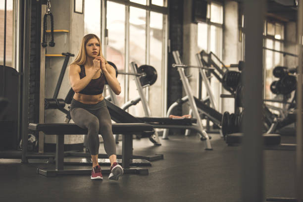 istock Single-leg squat with the help of a bench 1207528457