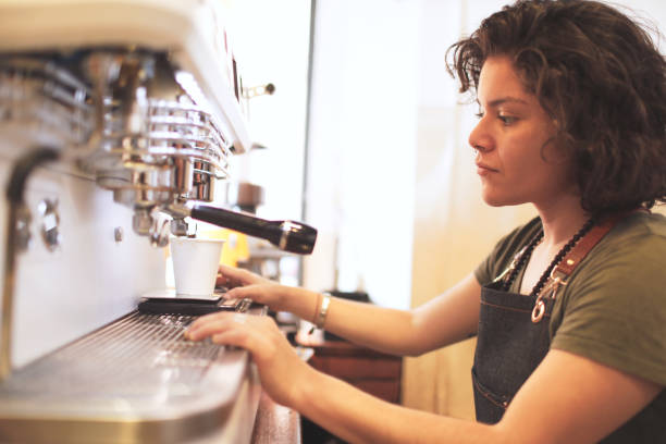 istock One hipster barista preparing coffee in an espresso machine. 1207528764
