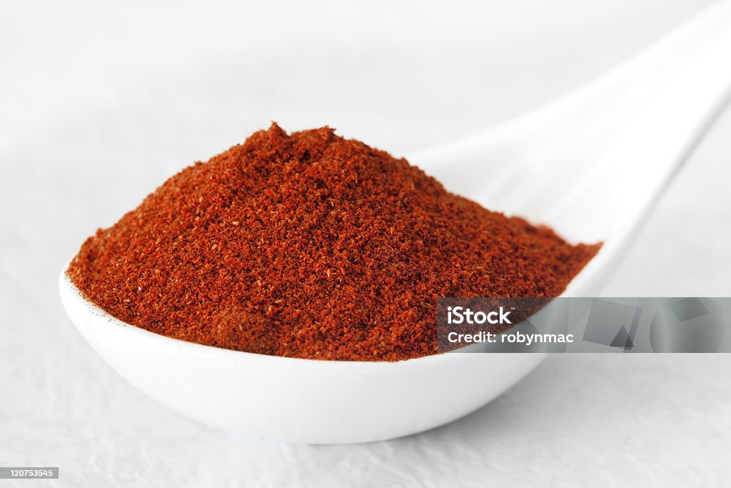 paprika Spoonful of paprika, in soft focus.  More herbs and spices:   http://robynm.smugmug.com/photos/265712091_f6Mdn-L.jpg Close-up Stock Photo