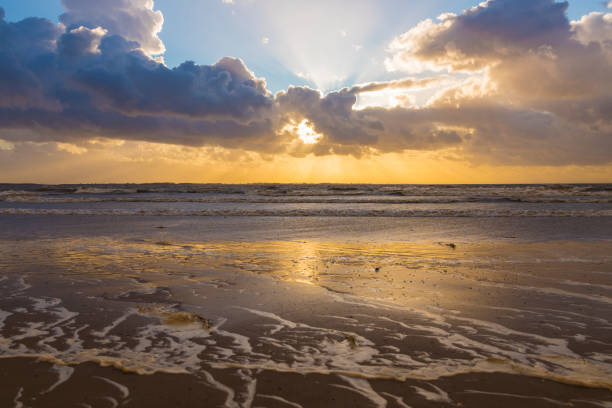istock clouds and sunset at rockanje north sea beach 1207537427